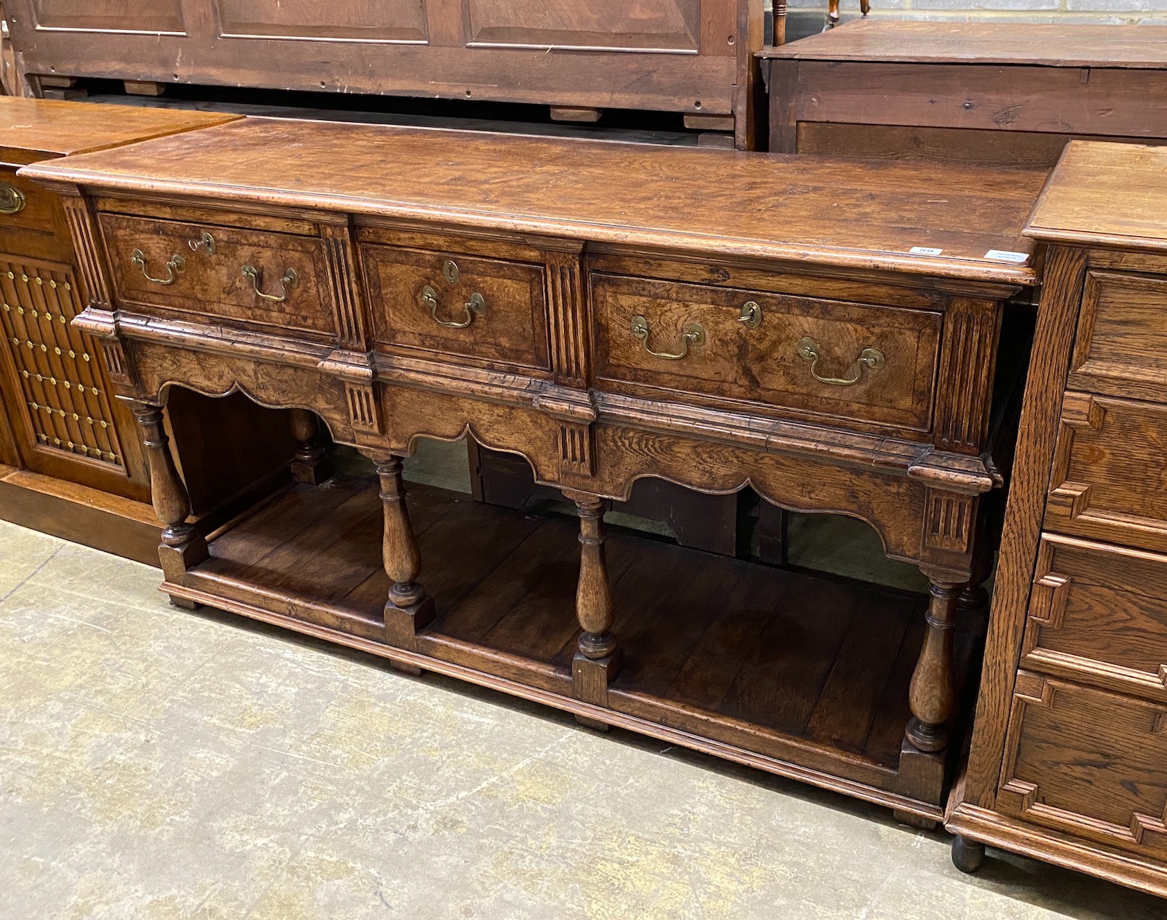 An early 18th century style banded burr oak low pot-board dresser, width 152cm, depth 49cm, height 84cm